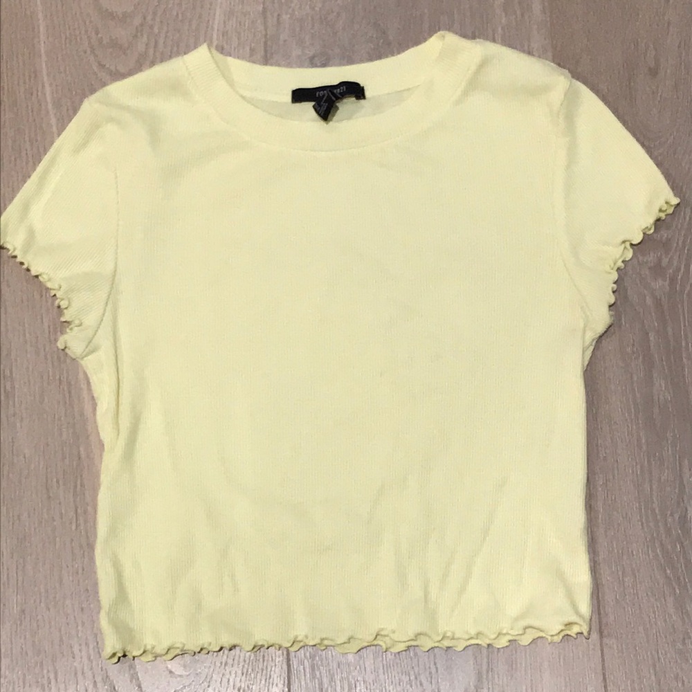A pastel yellow crop top, barely worn